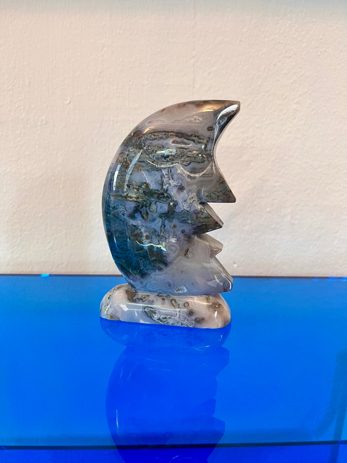 Moss agate moon carving